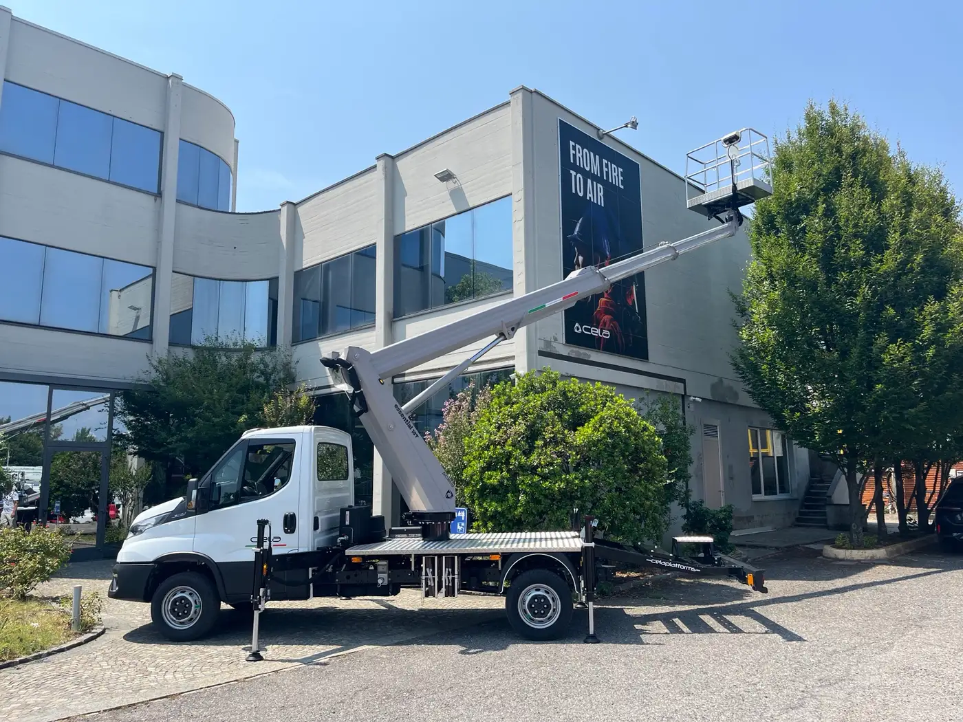 Essential 18T stabilised with the boom raised in front of the CELA Industry factory